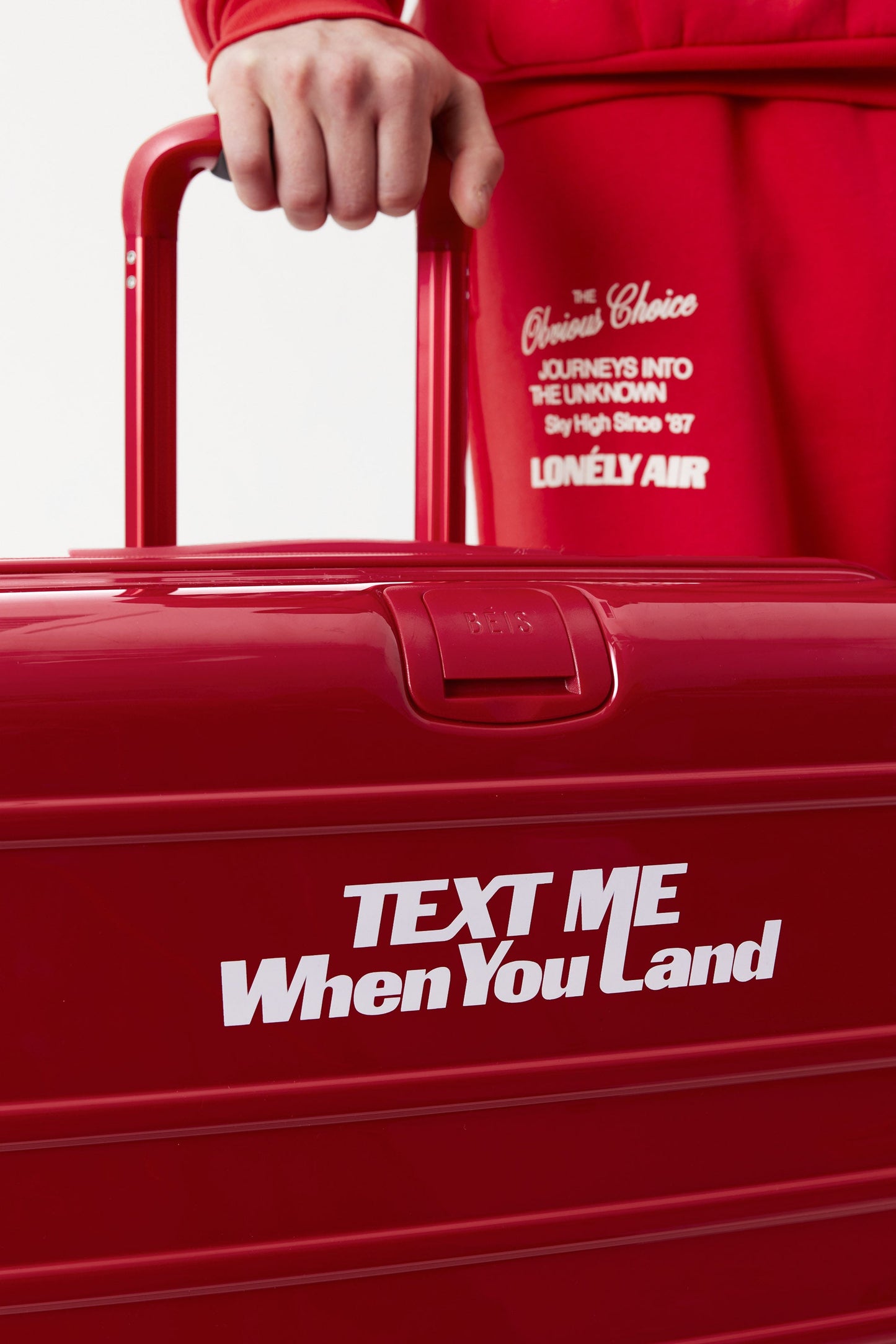 The Medium Check-In Roller in Text Me Red