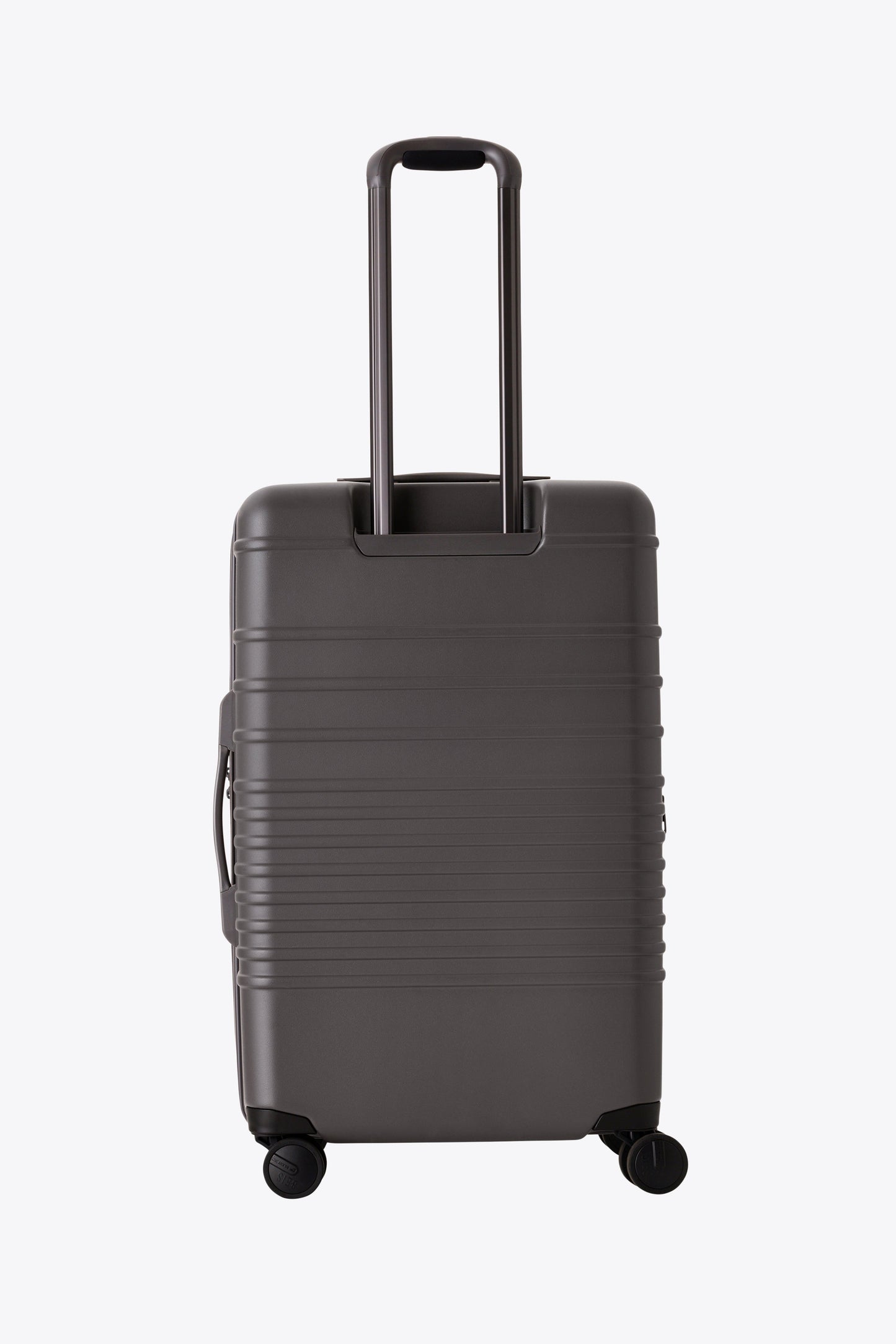 The Medium Check-In Roller in Charcoal