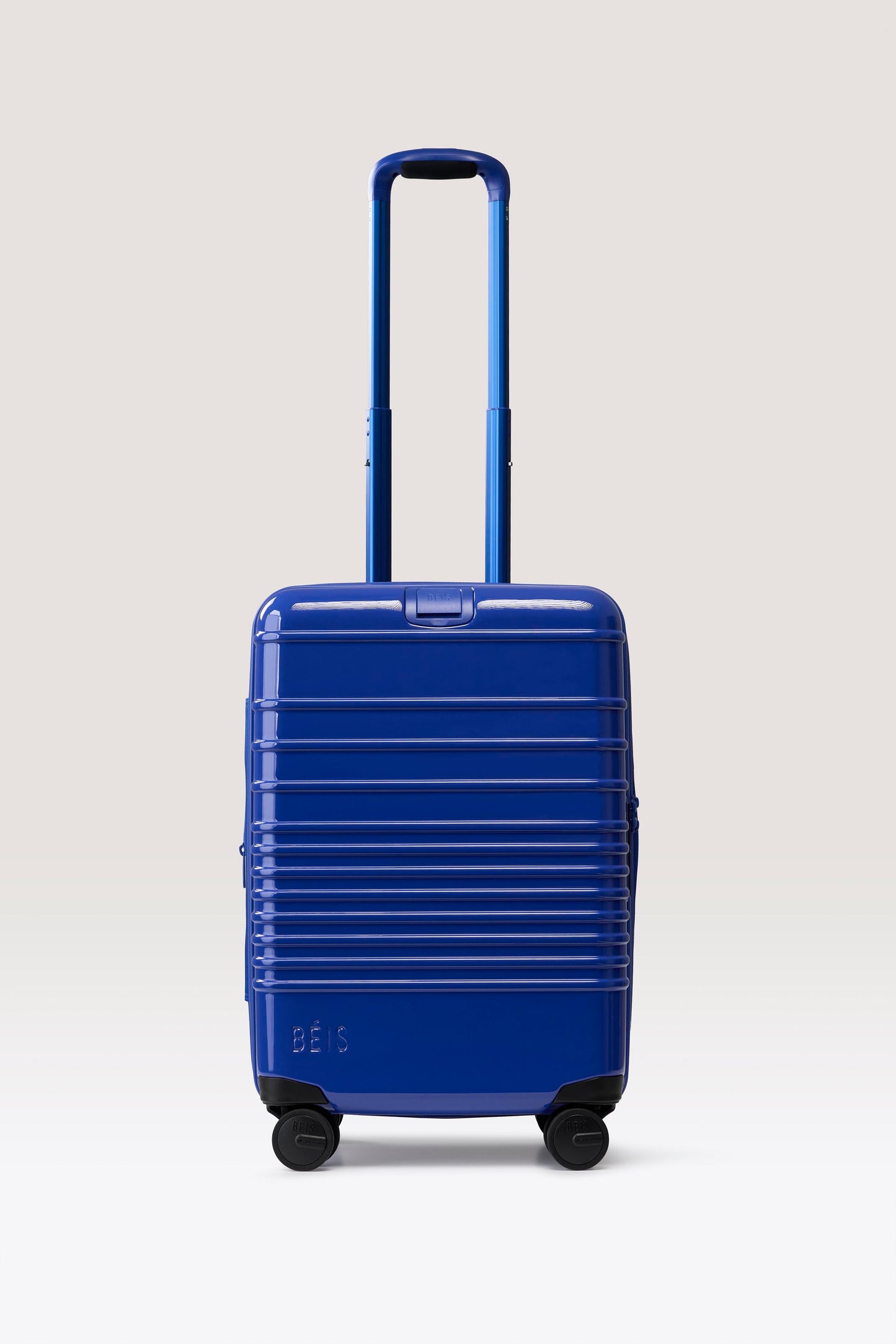 The Carry-On Roller in Glossy Cobalt Blue