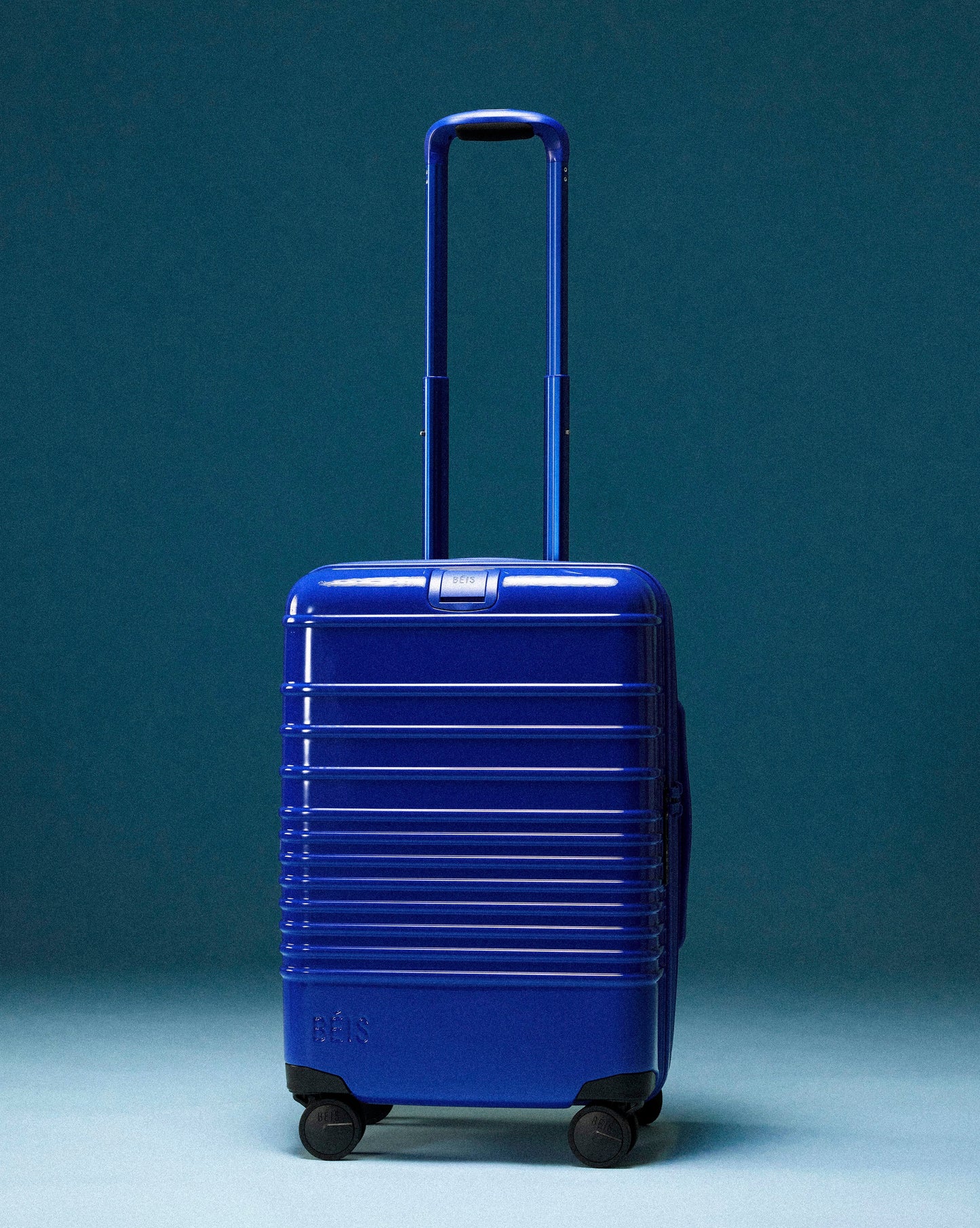 The Carry-On Roller in Glossy Cobalt Blue