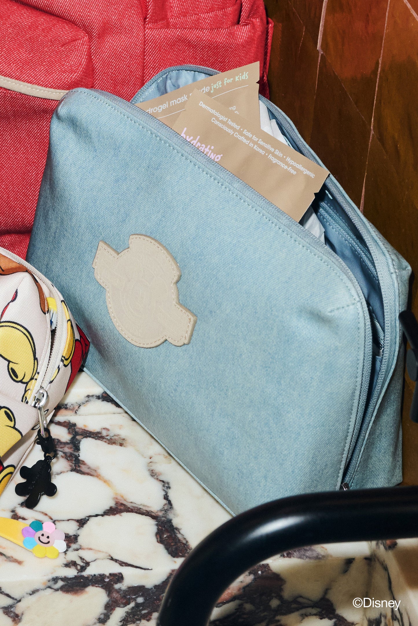 The Disney Small Cosmetic Pouch in Blue Jeans