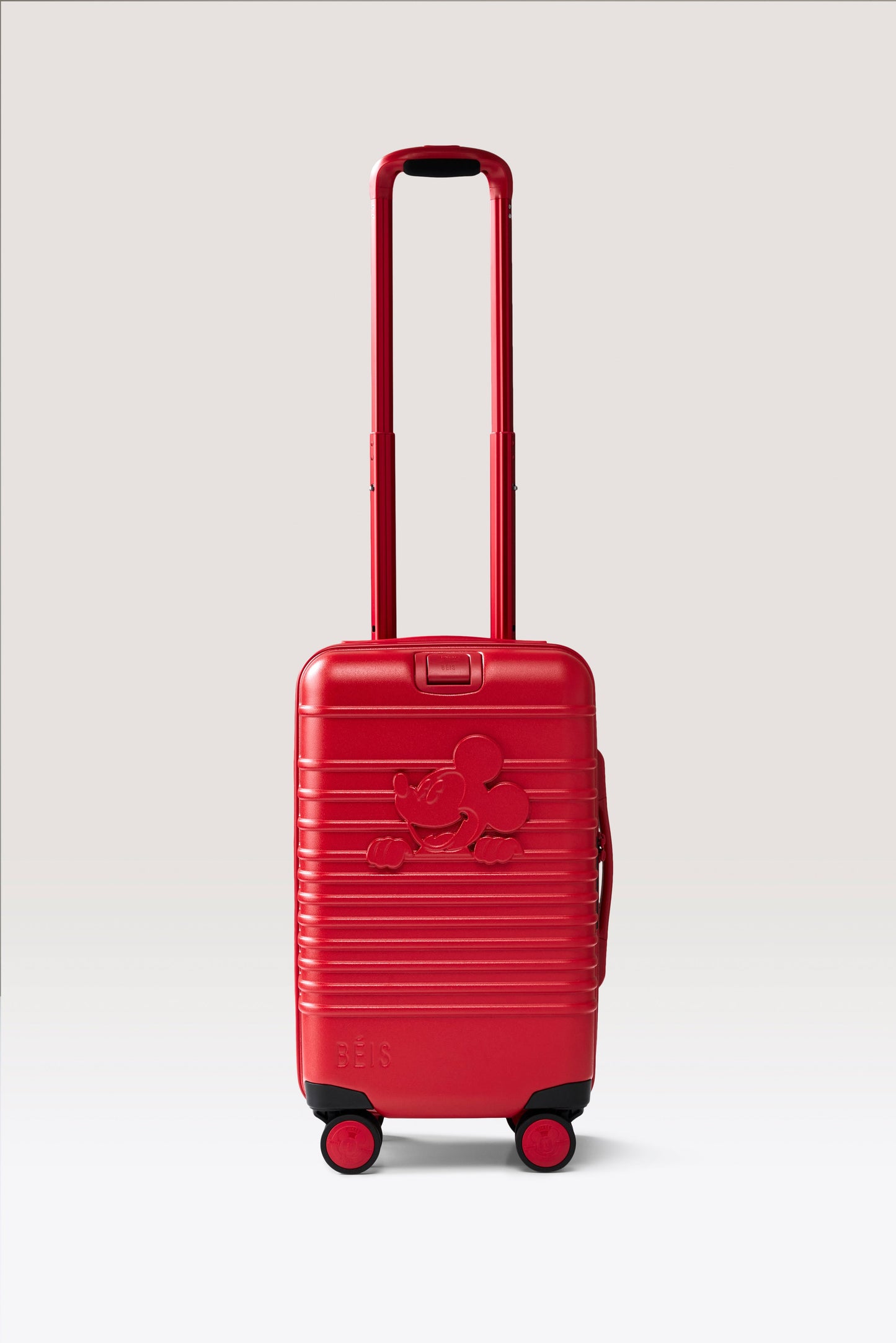 The Disney Small Carry-On Roller in Mickey Mouse Red