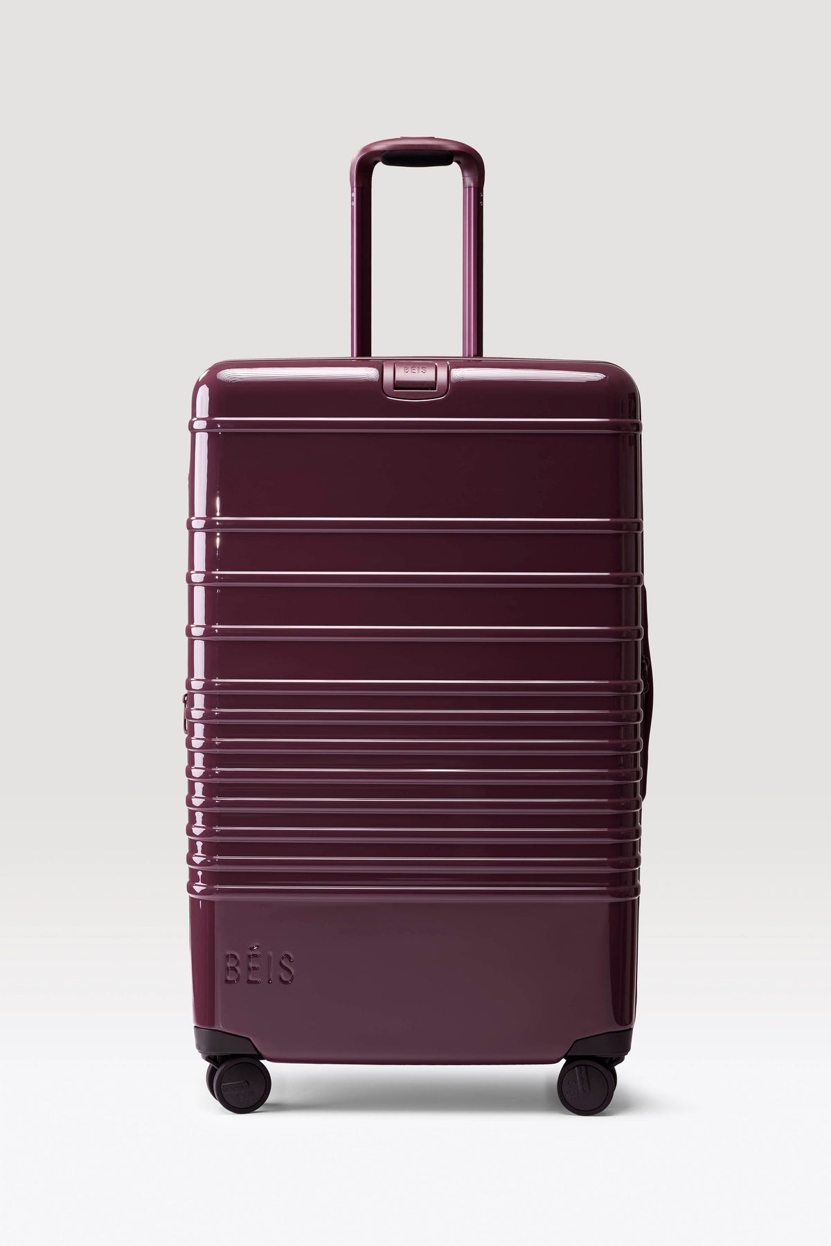 The Large Check-In Roller in Glossy Plum