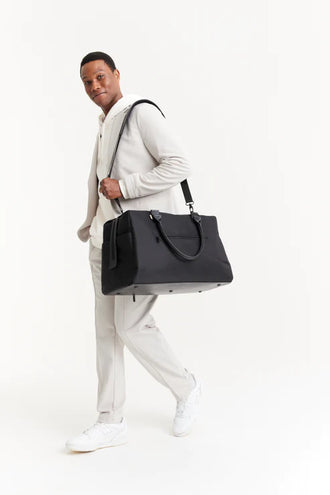 The Commuter Duffle In Black on model