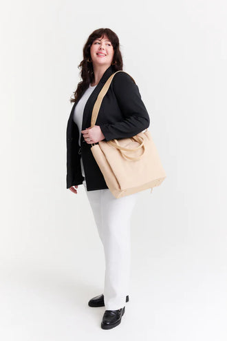 The Commuter Tote In Beige on model