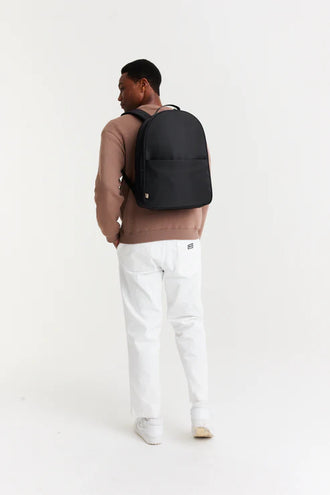The Commuter Backpack In Black on model