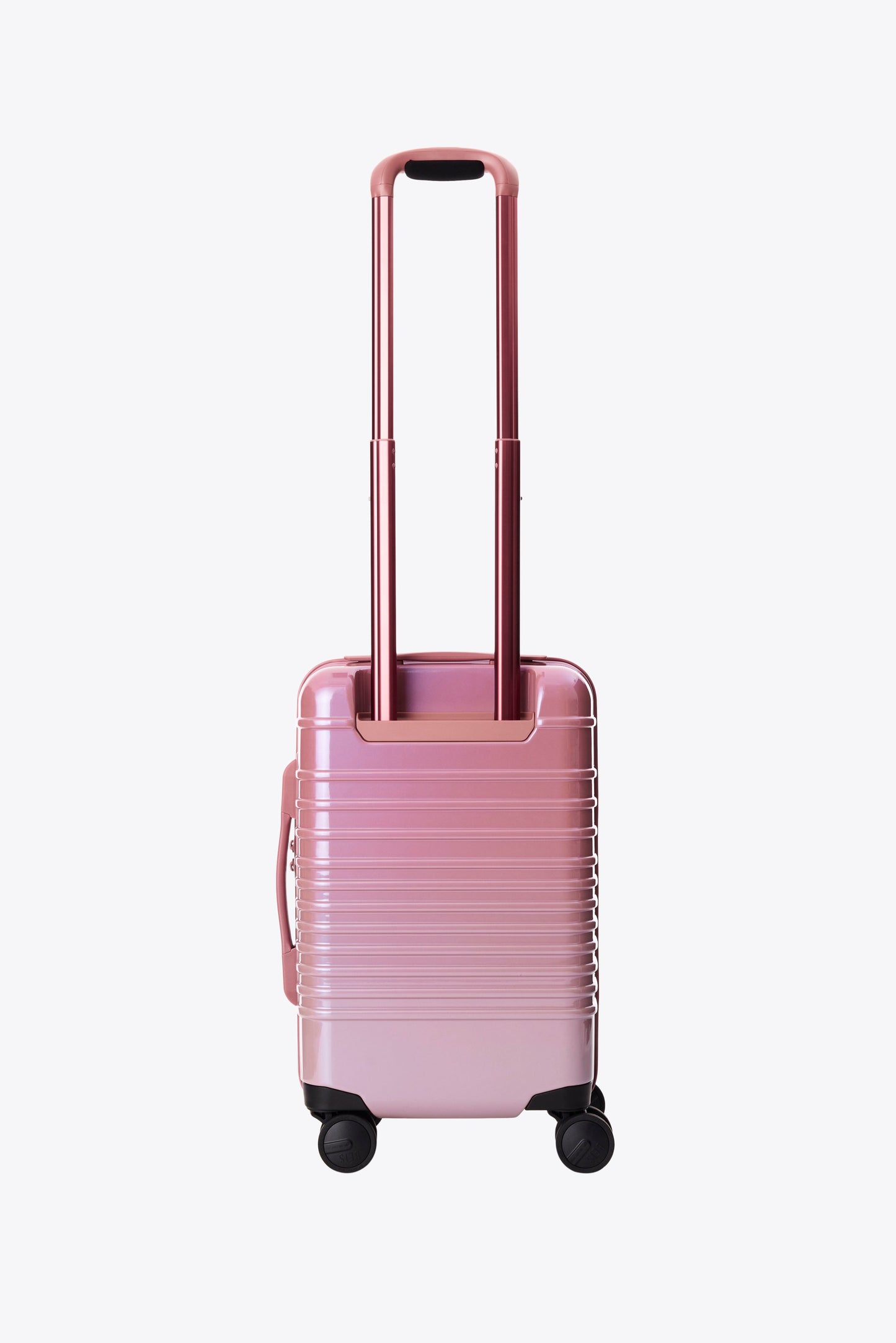 The Small Carry-On Roller in Wicked Pink