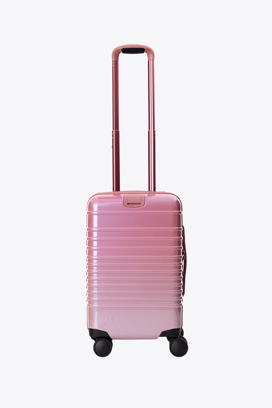 The Small Carry-On Roller in Wicked Pink