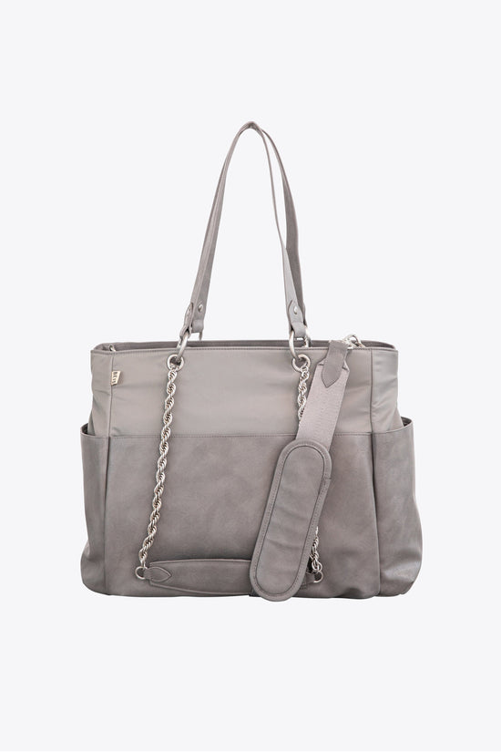 Le sac à langer en gris