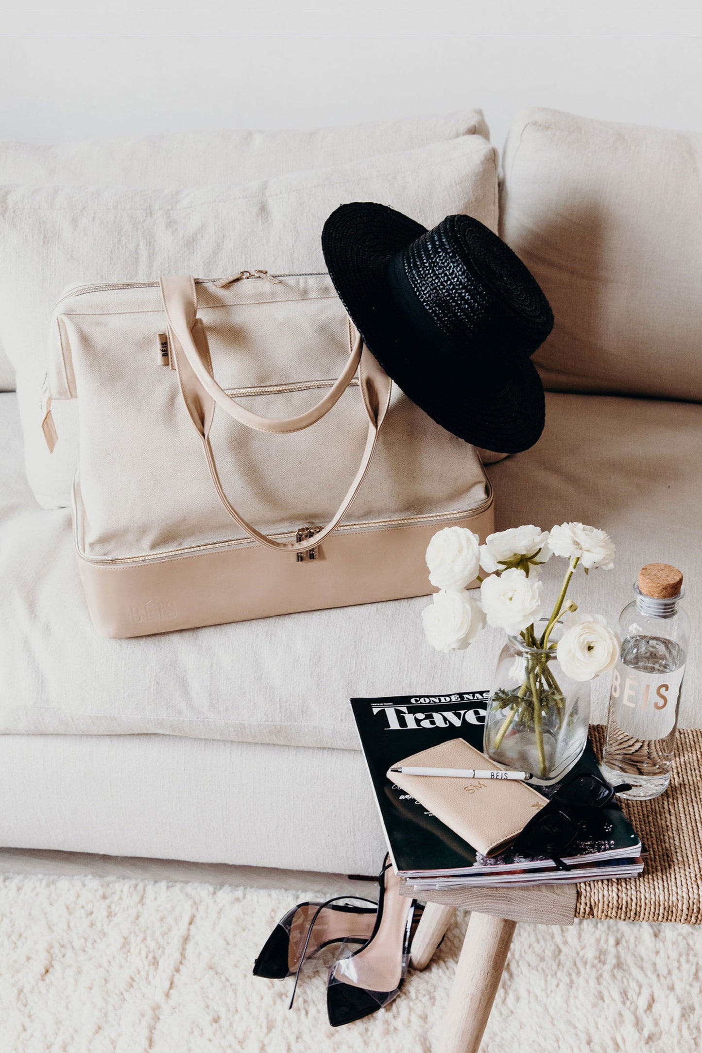 BEIS by Shay Mitchell | The Weekender in Beige on couch in living room